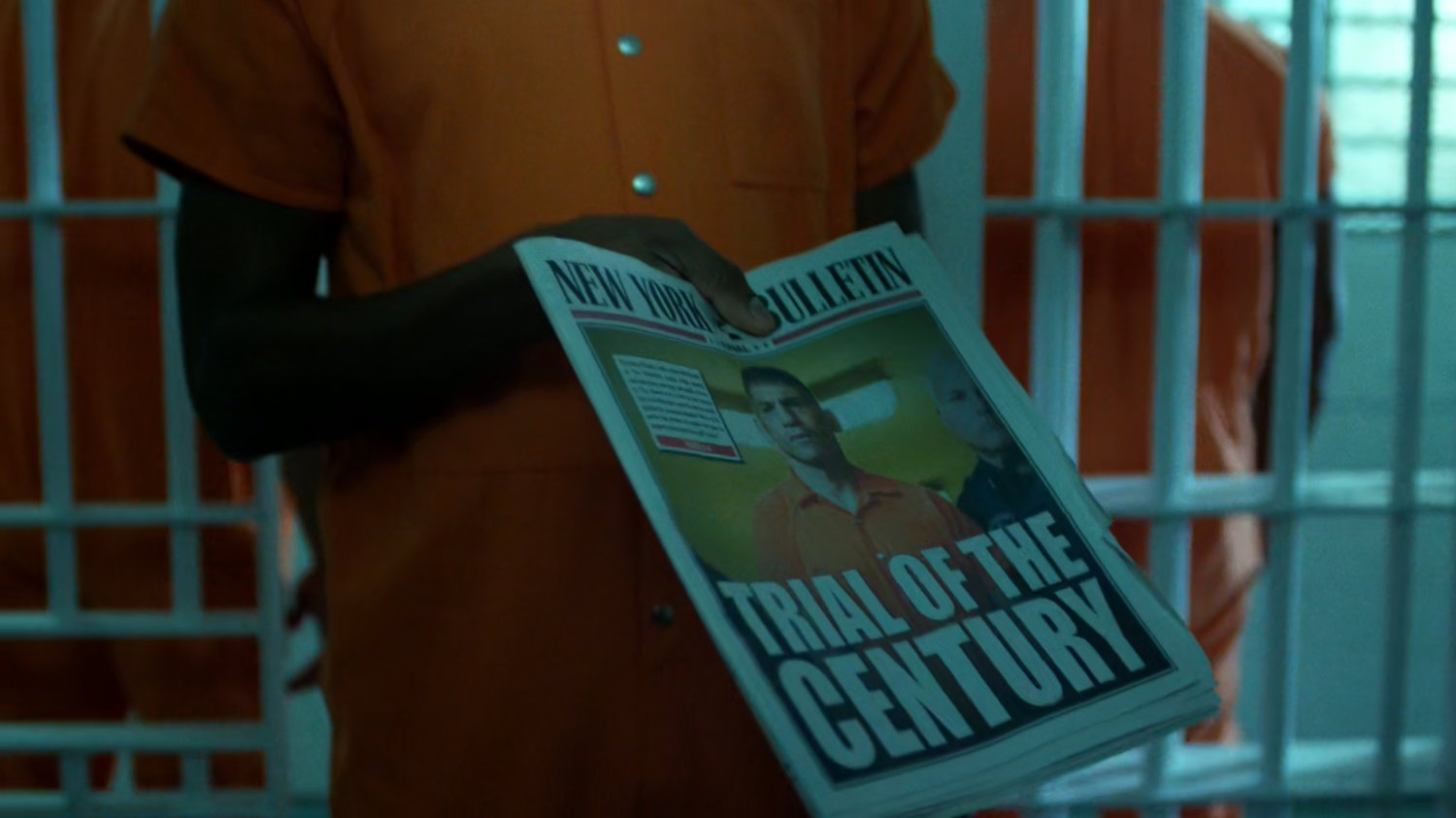 Stewart shows newspaper with headline "Trial of the Century."