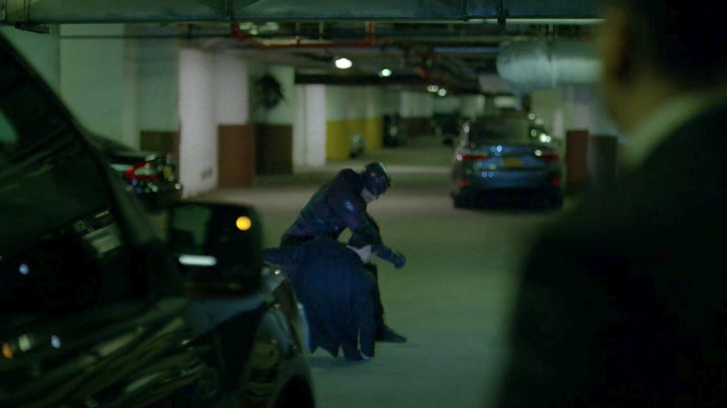 Daredevil attacking bodyguard in Yakatomi parking garage.
