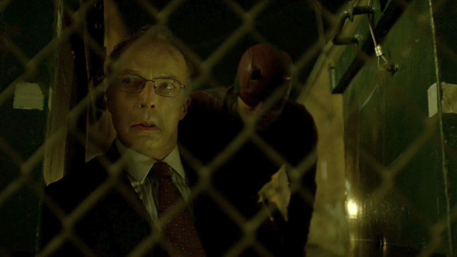 Stan and Daredevil hiding behind dumpsters outside The Farm.