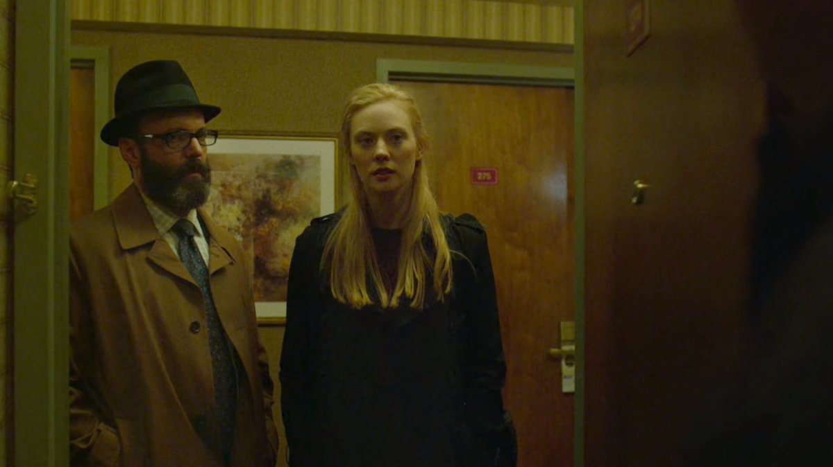 Karen and Ellison in hallway outside Tepper's motel room.