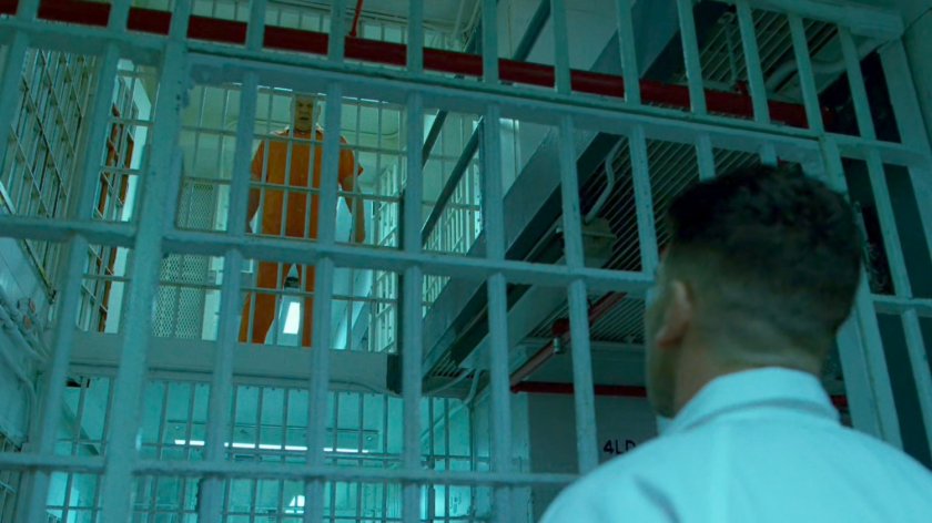 Frank talks with Fisk through the bars of Ryker's Island correctional facility.
