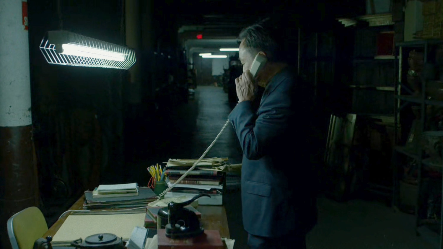 Hirochi answers a phone at The Farm.