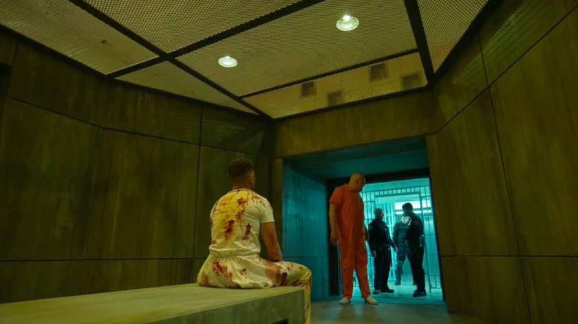 Fisk approaches Frank in a solitary room at Ryker's Island correctional facility.