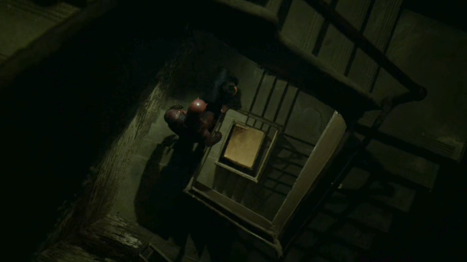 Daredevil and Stan Hirochi descend a very long, windy stairway.
