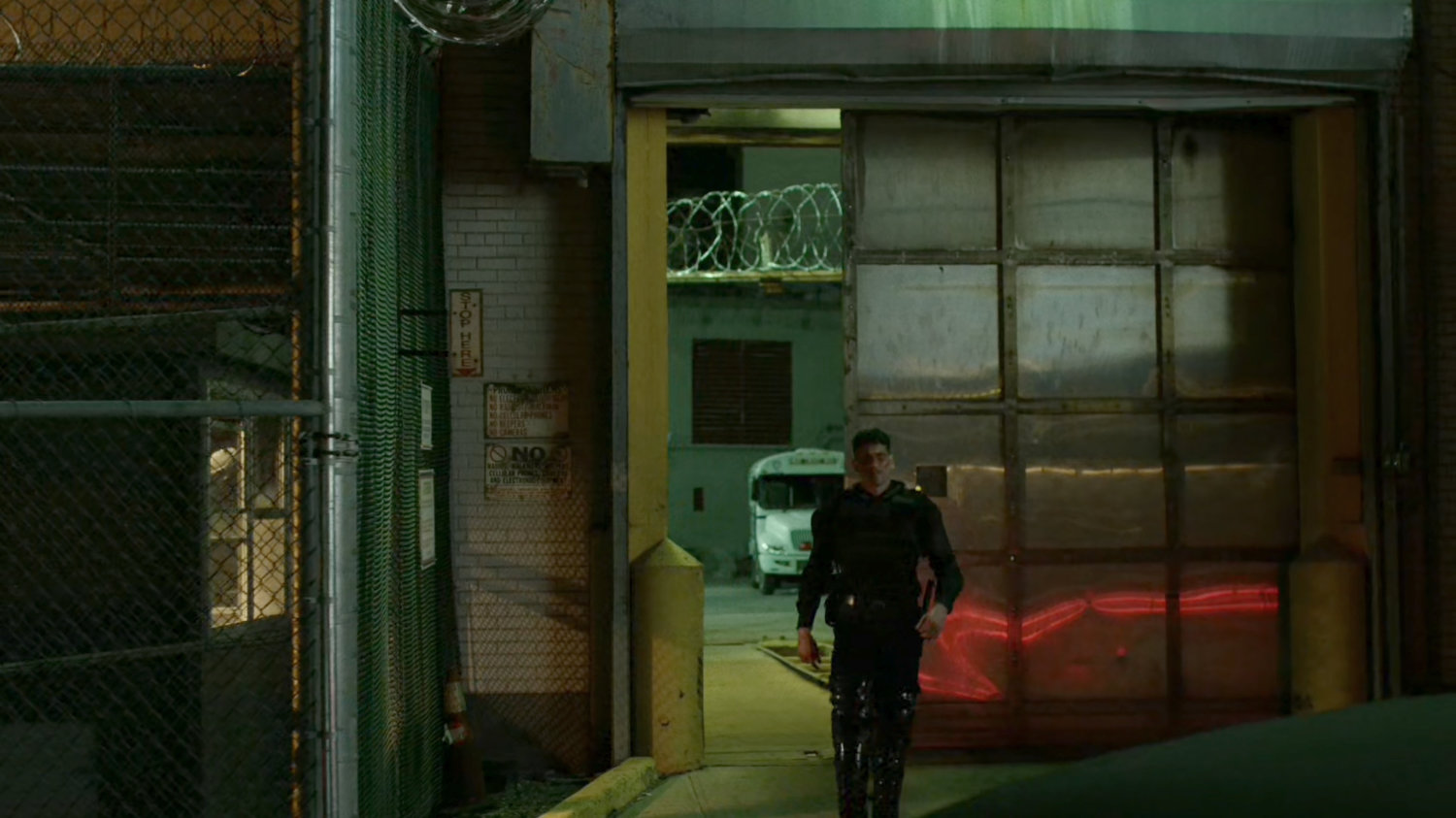 Frank disguised as a riot guard walking out of Ryker's Island correctional facility.