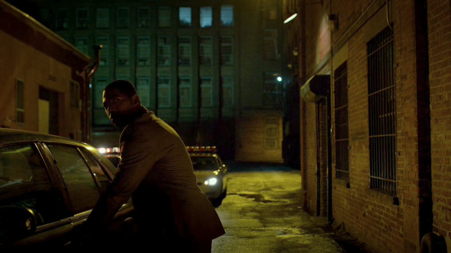 Detective Mahoney getting into his car outside "The Farm."
