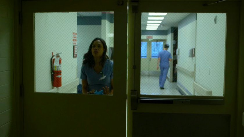 Claire walks through a door in the remodeled wing of Metro-General.