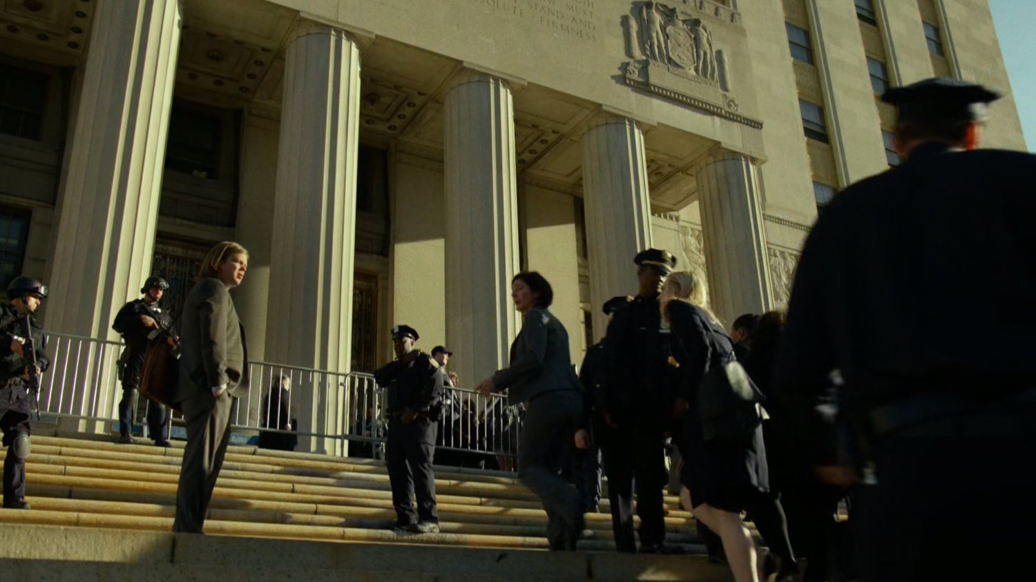 Foggy and Karen with police officers and others outside the Courthouse.