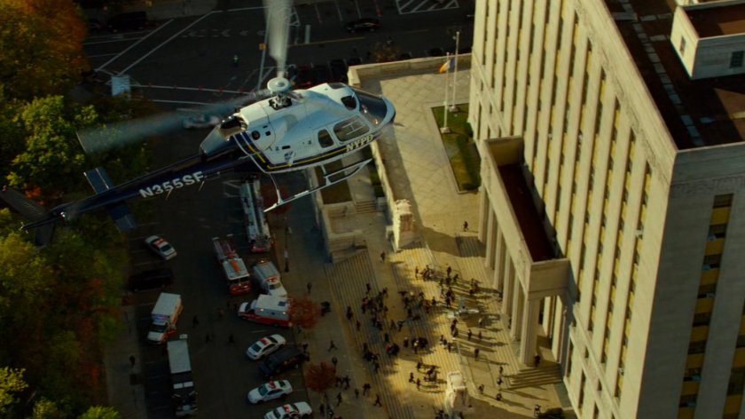 Aerial of helicopter hovering over steps of Courthouse.