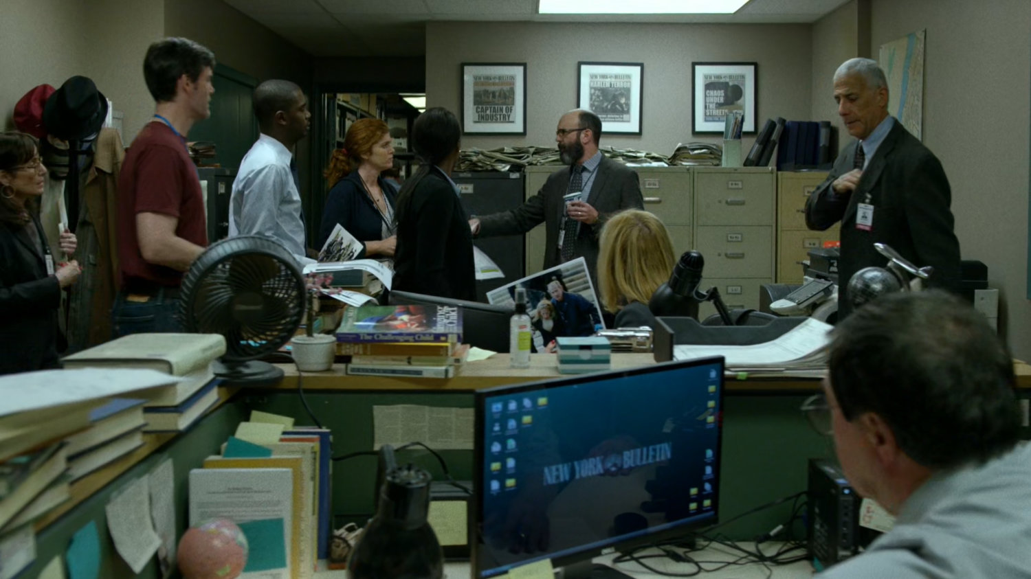 Ellison talks to the staff of the New York Bulletin in their bullpen.