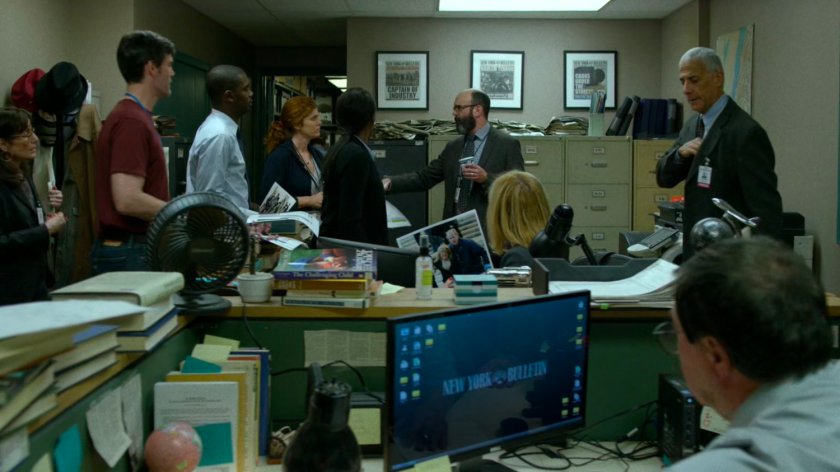 Ellison talks to the staff of the New York Bulletin in their buillpen.