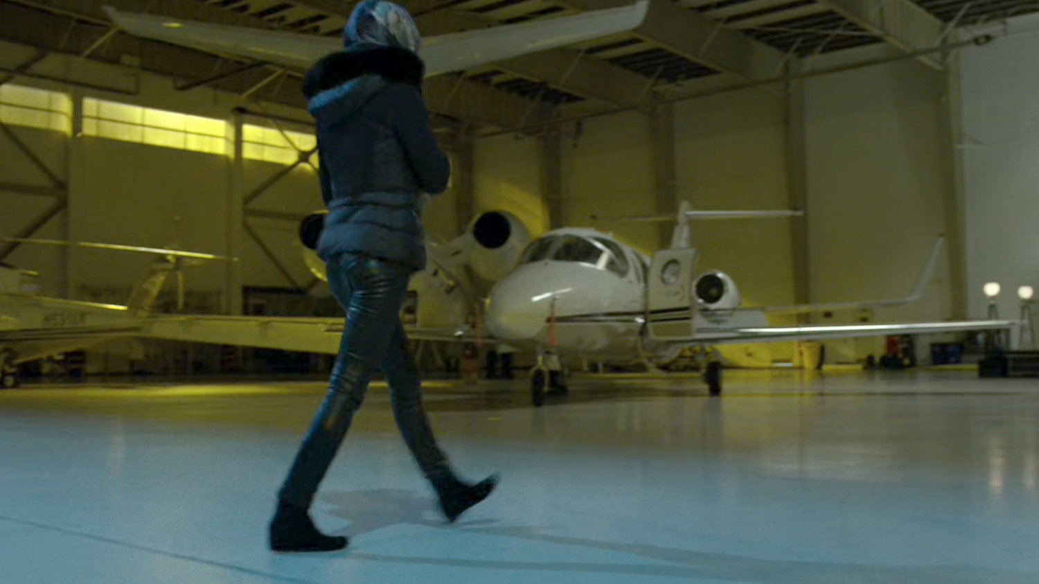 Elektra entering a private airplane hangar.