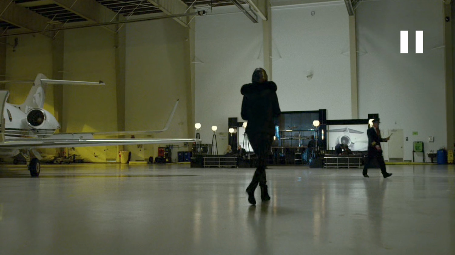 Elektra entering a private airplane hangar.