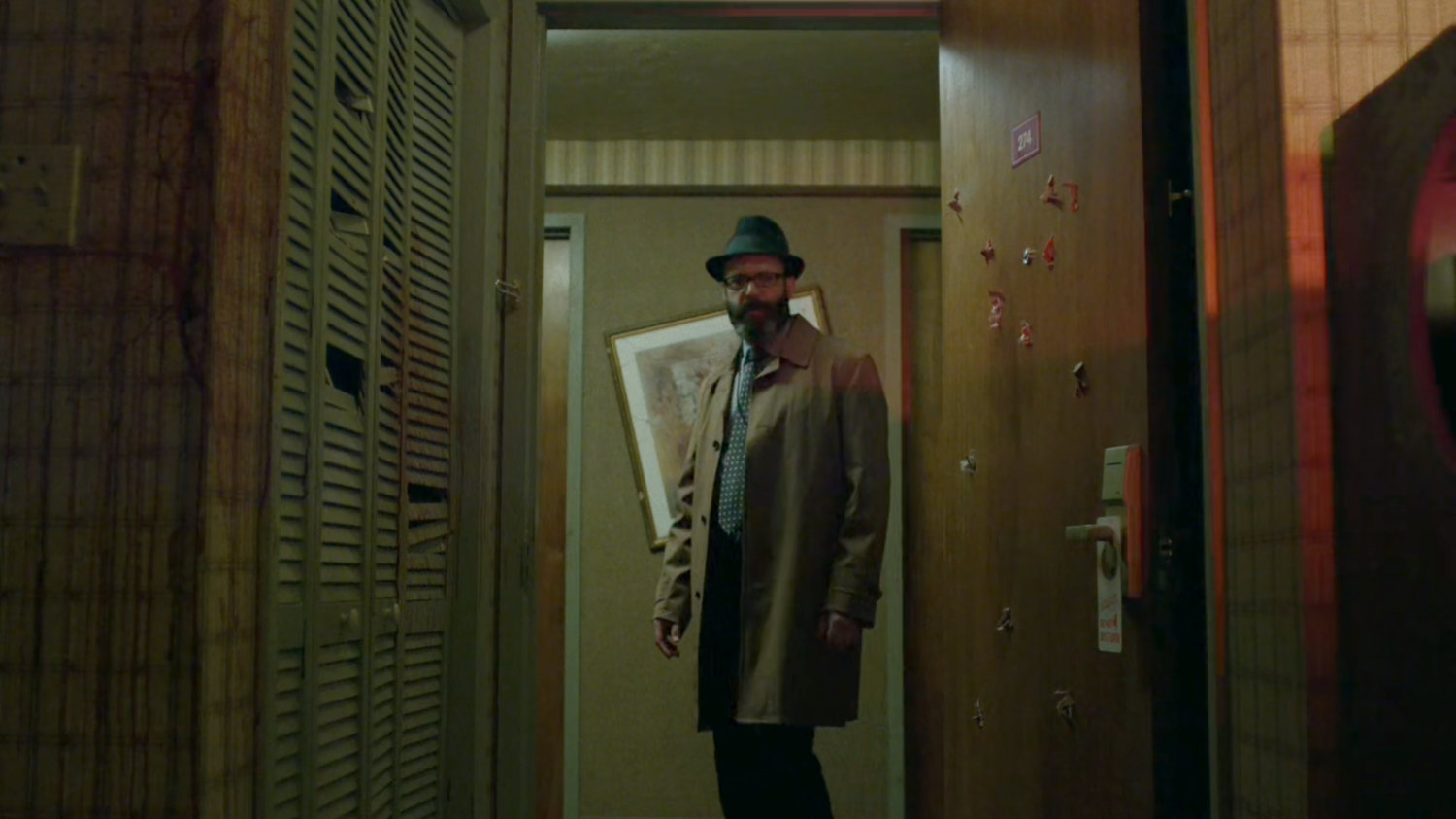 Ellison looking into Tepper's motel room.