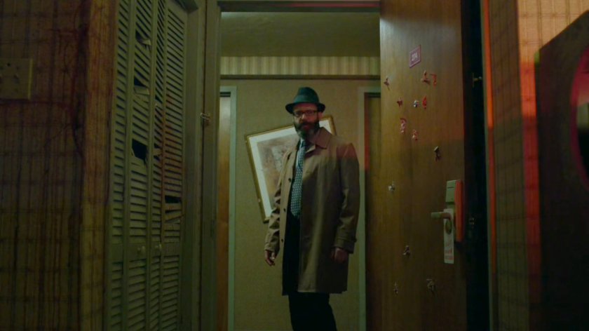 Ellison looking into Tepper's motel room.