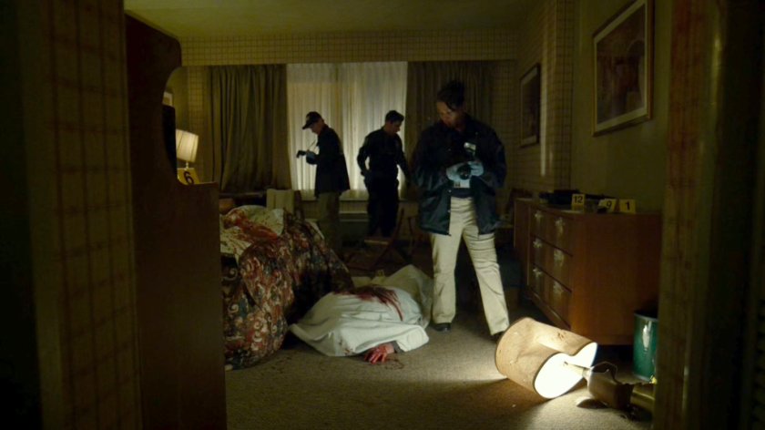 Officers and crime scene analysts inside Tepper's motel room.