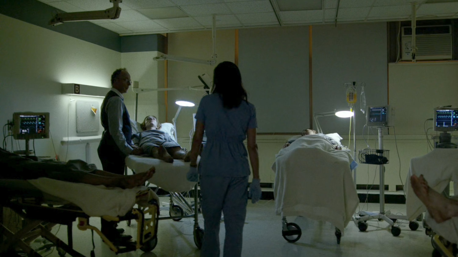 Claire, Stan and an "infected" patient in the remodeled wing of Metro-General.