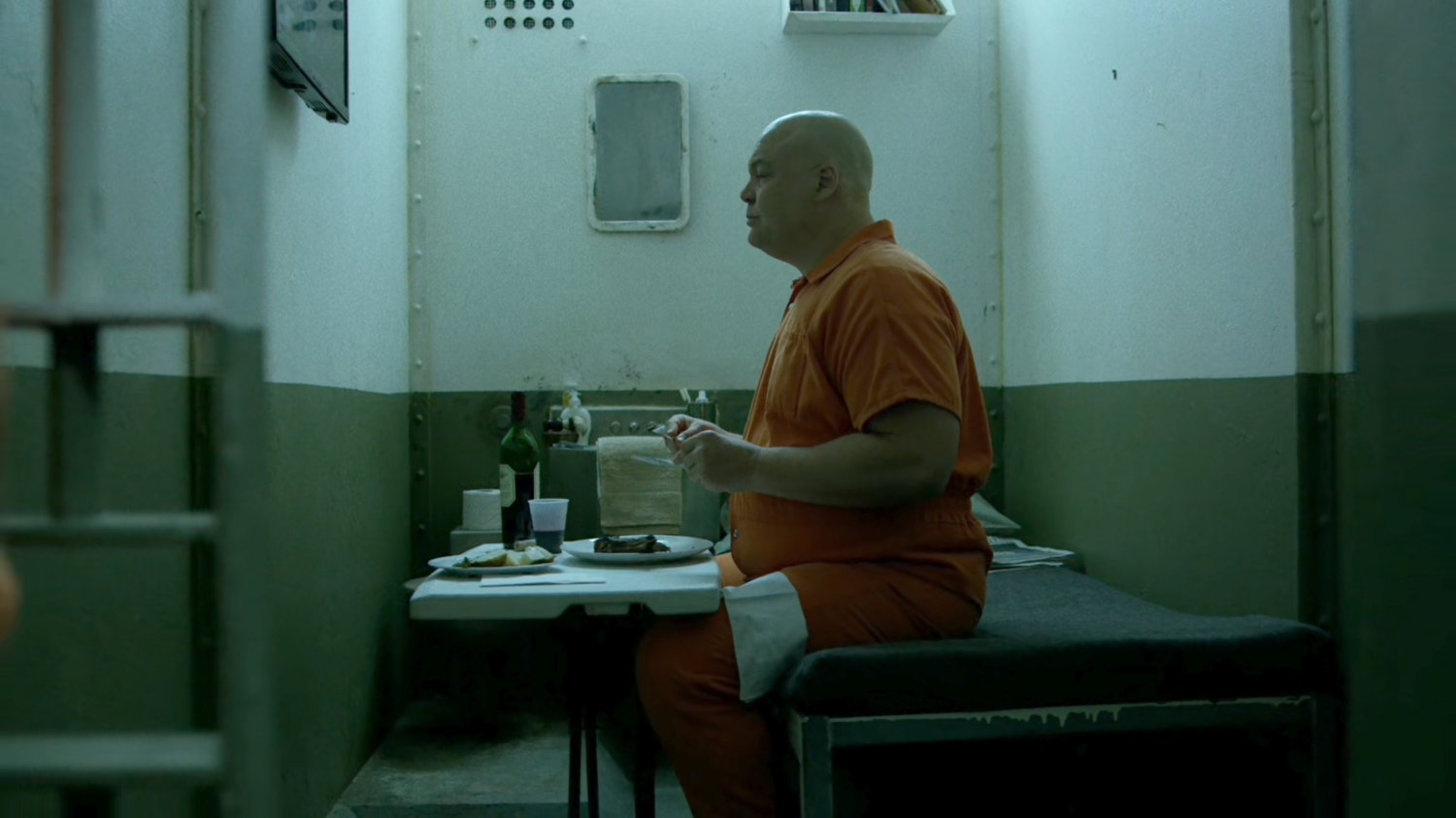 Wilson Fisk dining in his prison cell at Ryker's Island correctional facility.