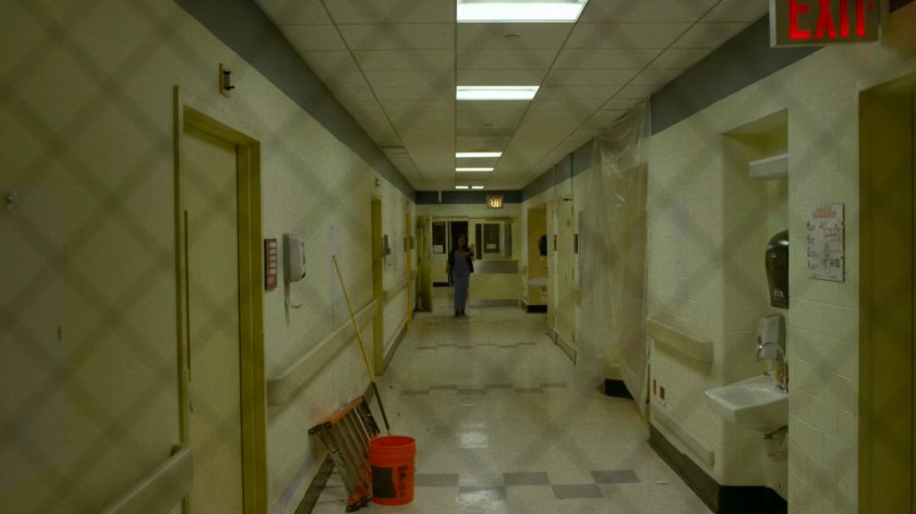 Claire in a hallway in a remodeled wing of Metro-General.