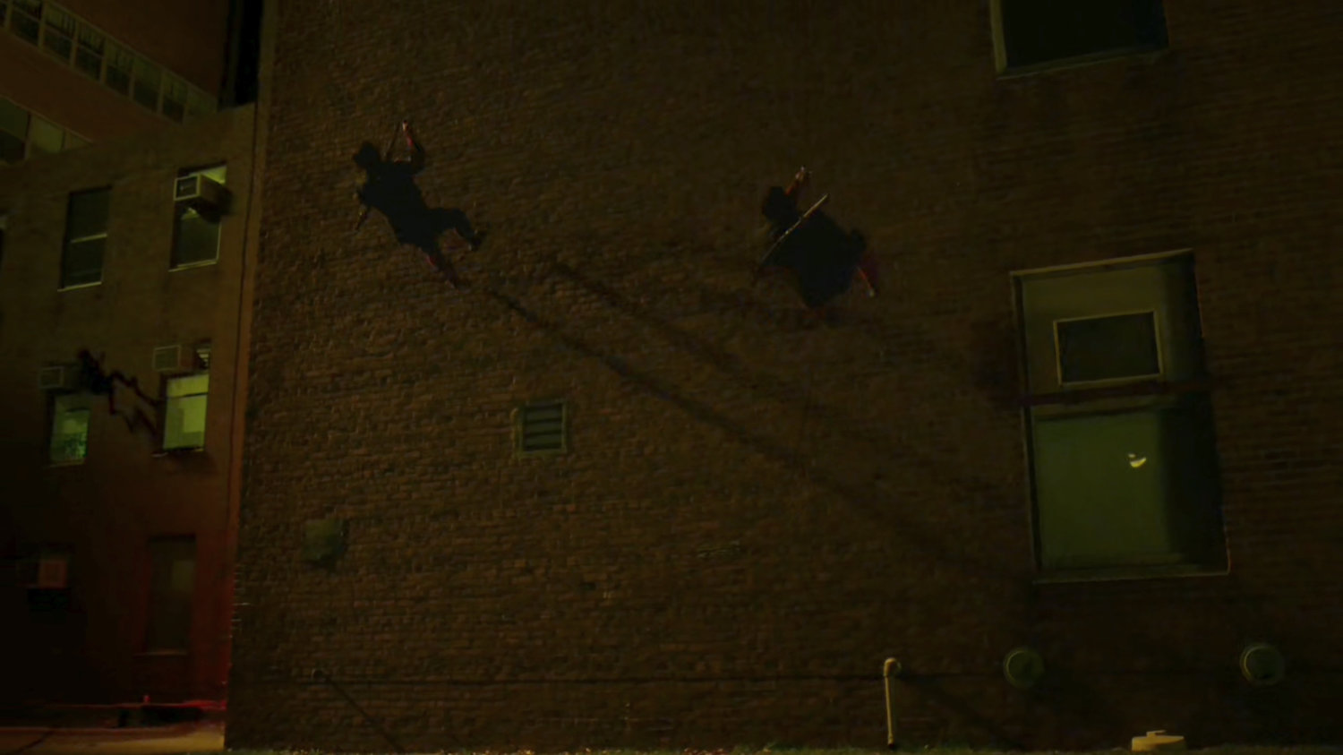 Hand Ninjas climb cables outside Metro-General hospital.