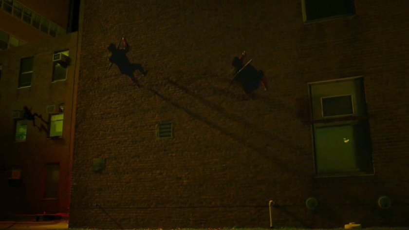 Hand Ninjas climb cables outside Metro-General hospital.