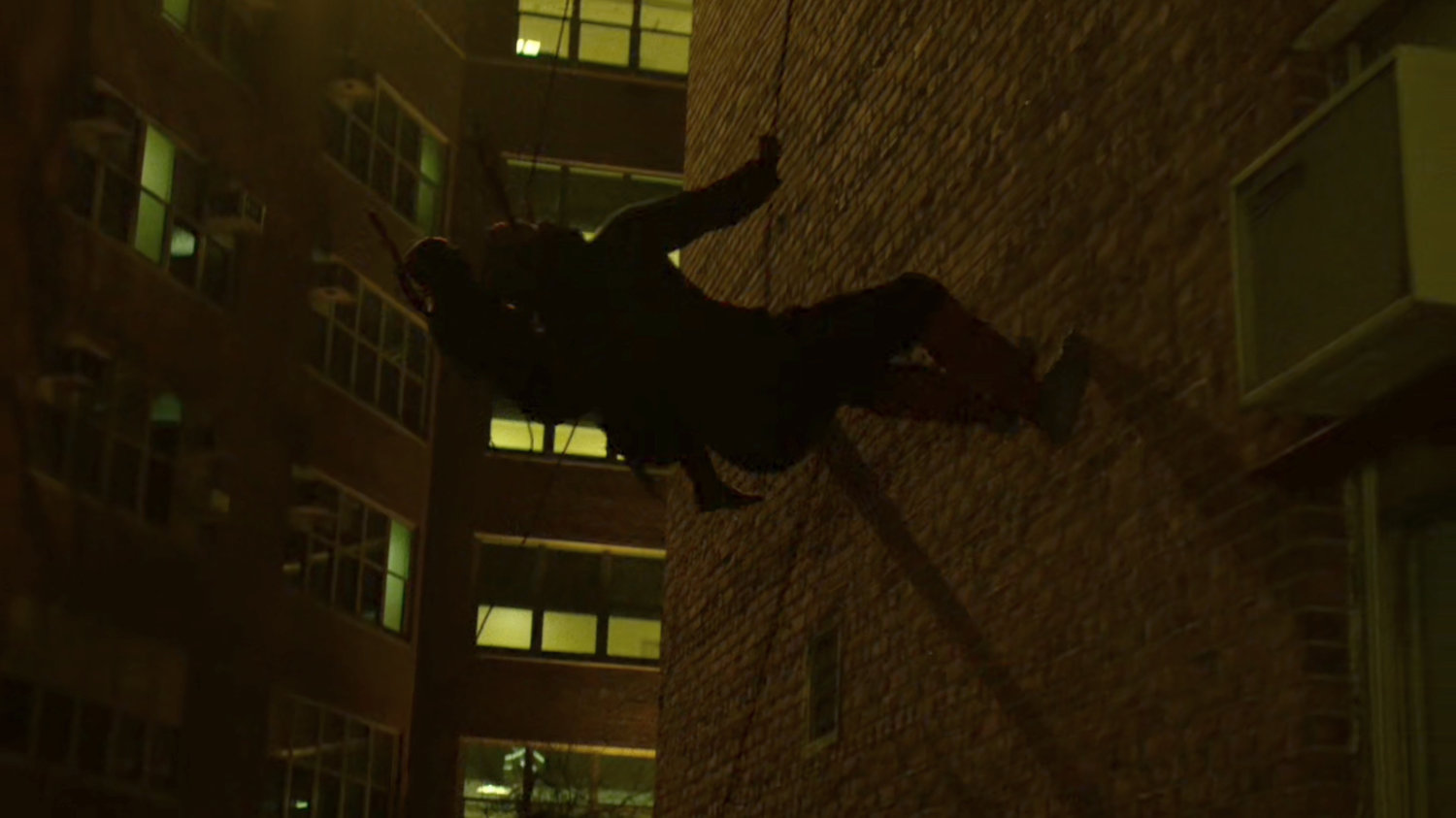 Hand Ninjas climb cables outside Metro-General hospital.