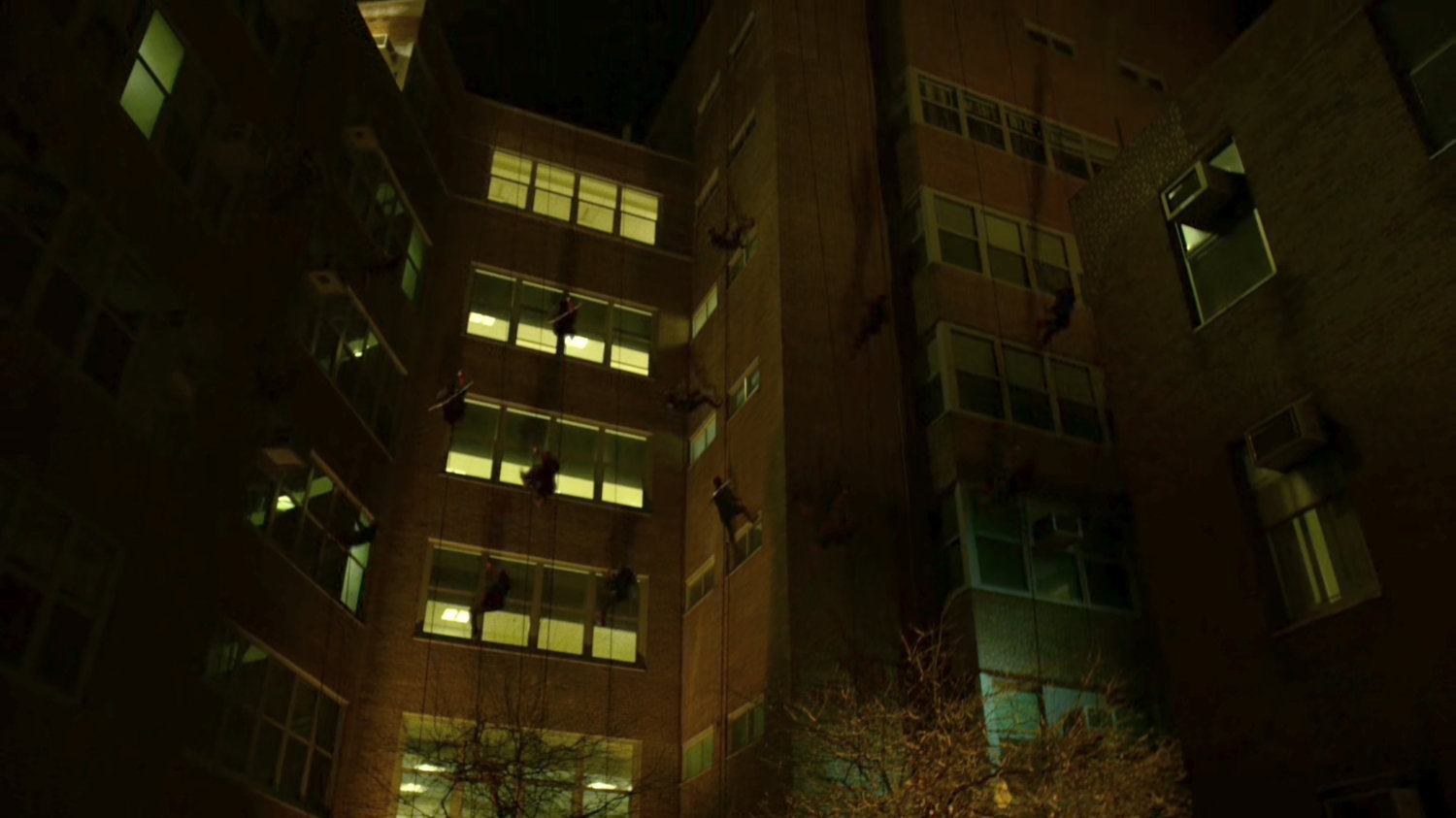 Hand Ninjas climb cables outside Metro-General hospital.