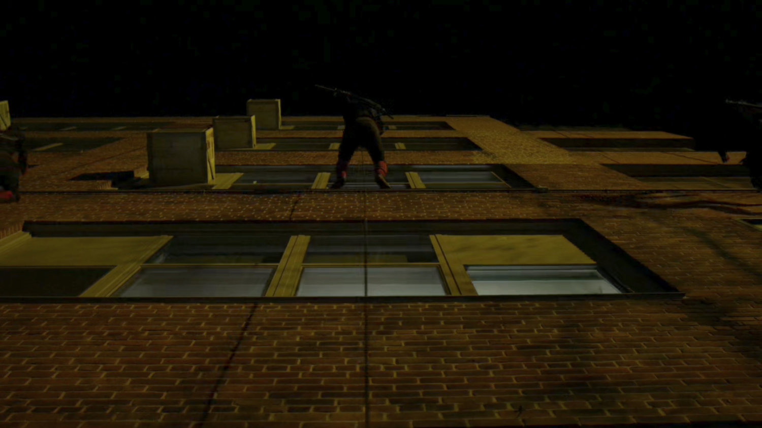 Hand Ninjas climb cables outside Metro-General hospital.