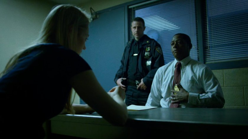 Karen and Detective Mahoney in interrogation room of the 15th Precinct.