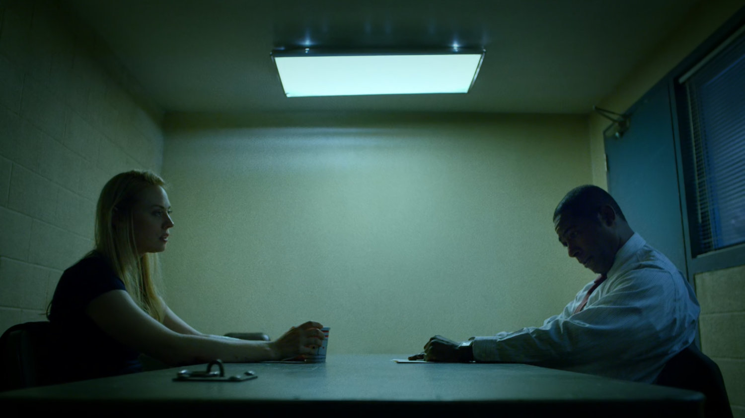 Karen and Detective Mahoney in interrogation room of the 15th Precinct.