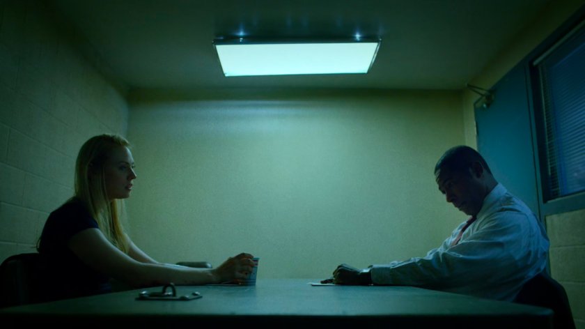 Karen and Detective Mahoney in interrogation room of the 15th Precinct.