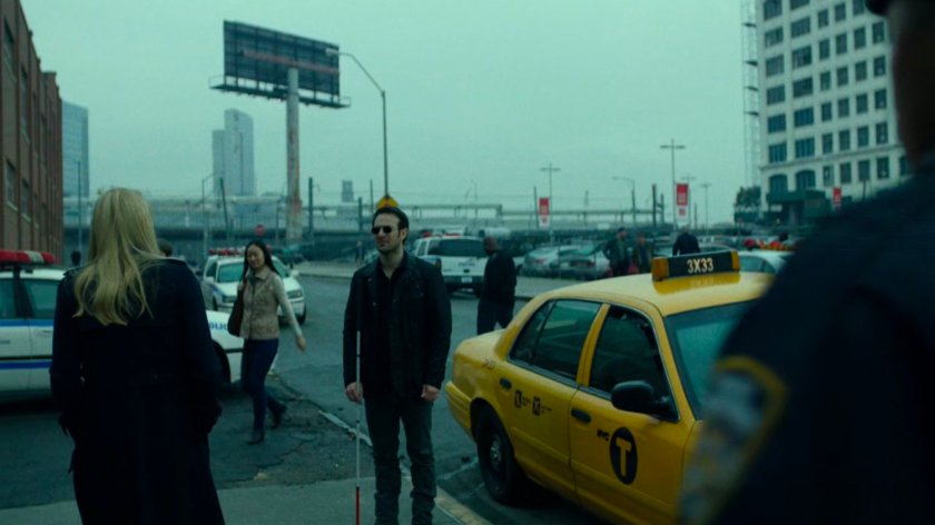 Karen talking to Matt on sidewalk outside 15th Precinct.