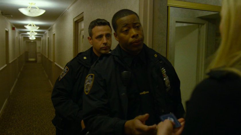 Police Officers and Karen outside her room at the Hotel Travel Inn.