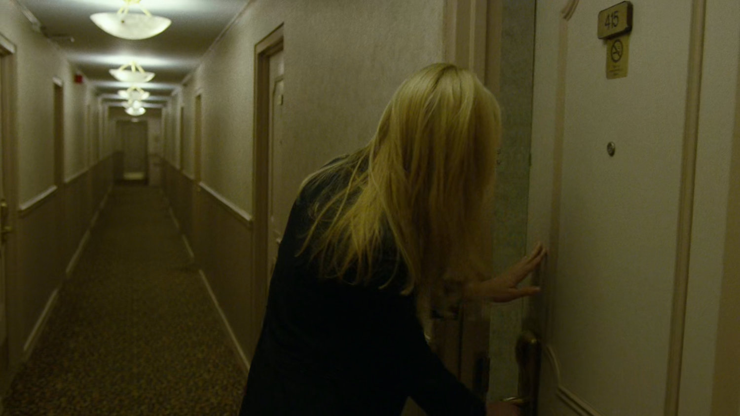 Karen in hallway at the Hotel Travel Inn.