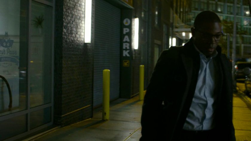 ADA Tower walks along a dark sidewalk.