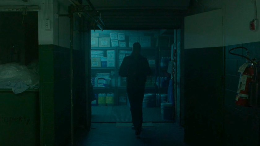 A man walking through a Chinese laundry.