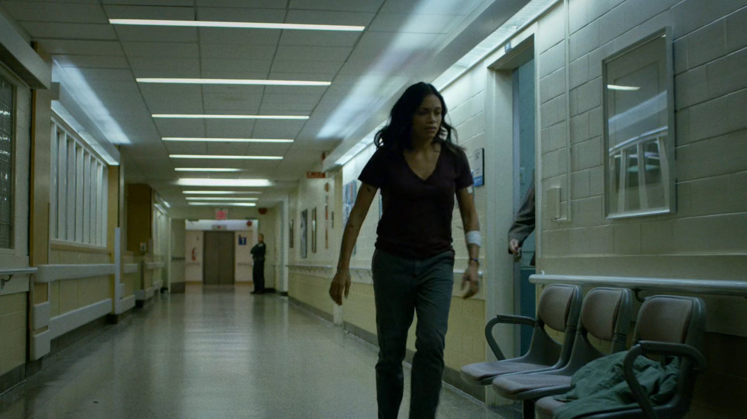 Claire in the administrative hallway of Metro-General hospital.