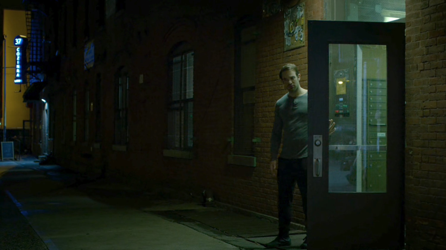 Matt steps outside the door to his apartment.