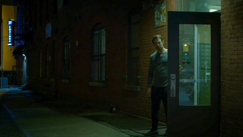 Matt steps outside the door to his apartment.