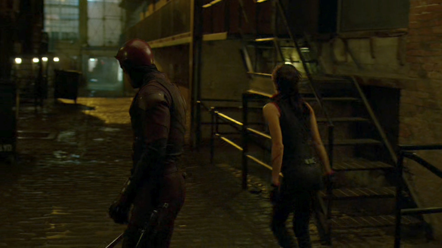 Daredevil and Elektra in the alley outside the Chaste headquarters.