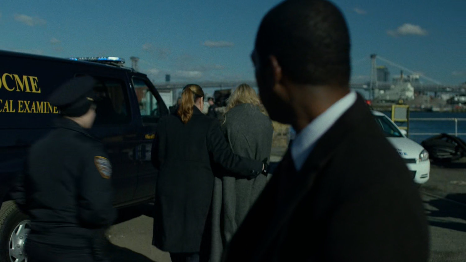 Detective Mahoney watches Karen being escorted away at Pier 81.