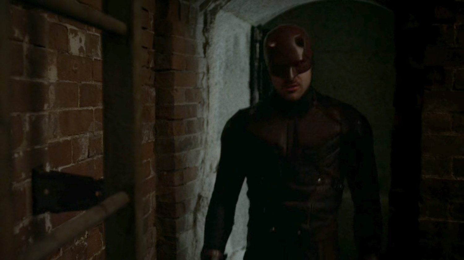 Daredevil in alcove under abandoned steam plant.