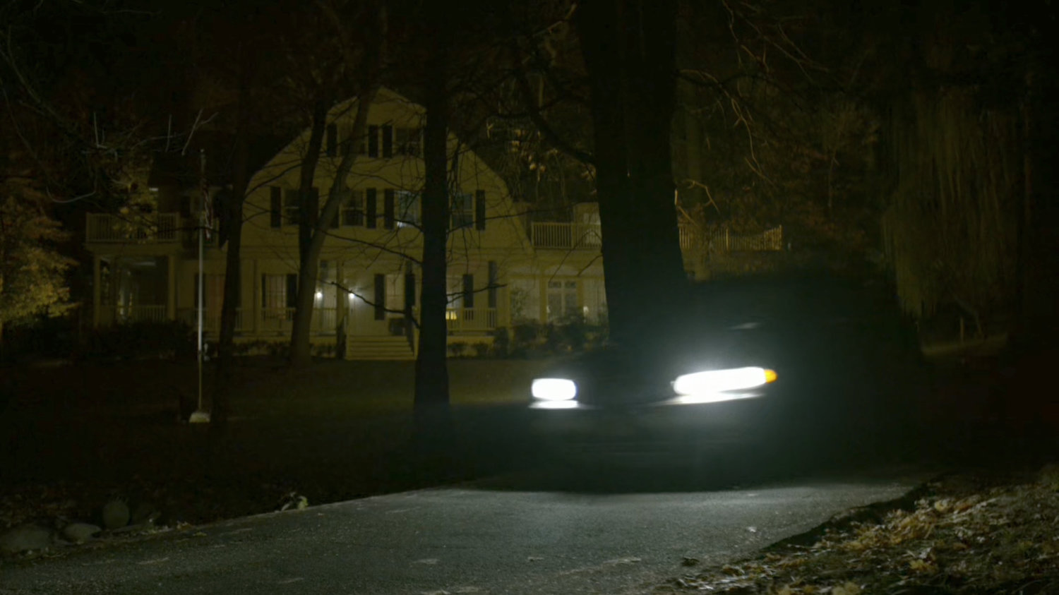 A car drives past the front of Schoonover's house.