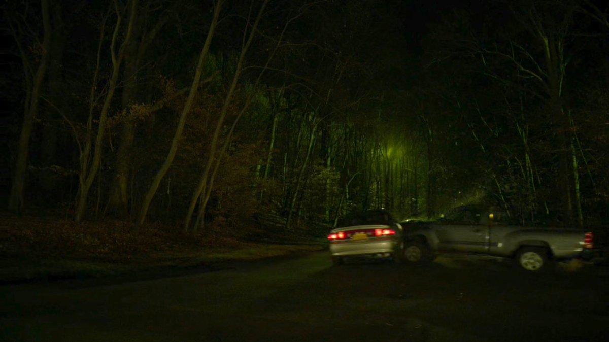 A pickup truck crashes into Karen's car on a dark, wooded road.