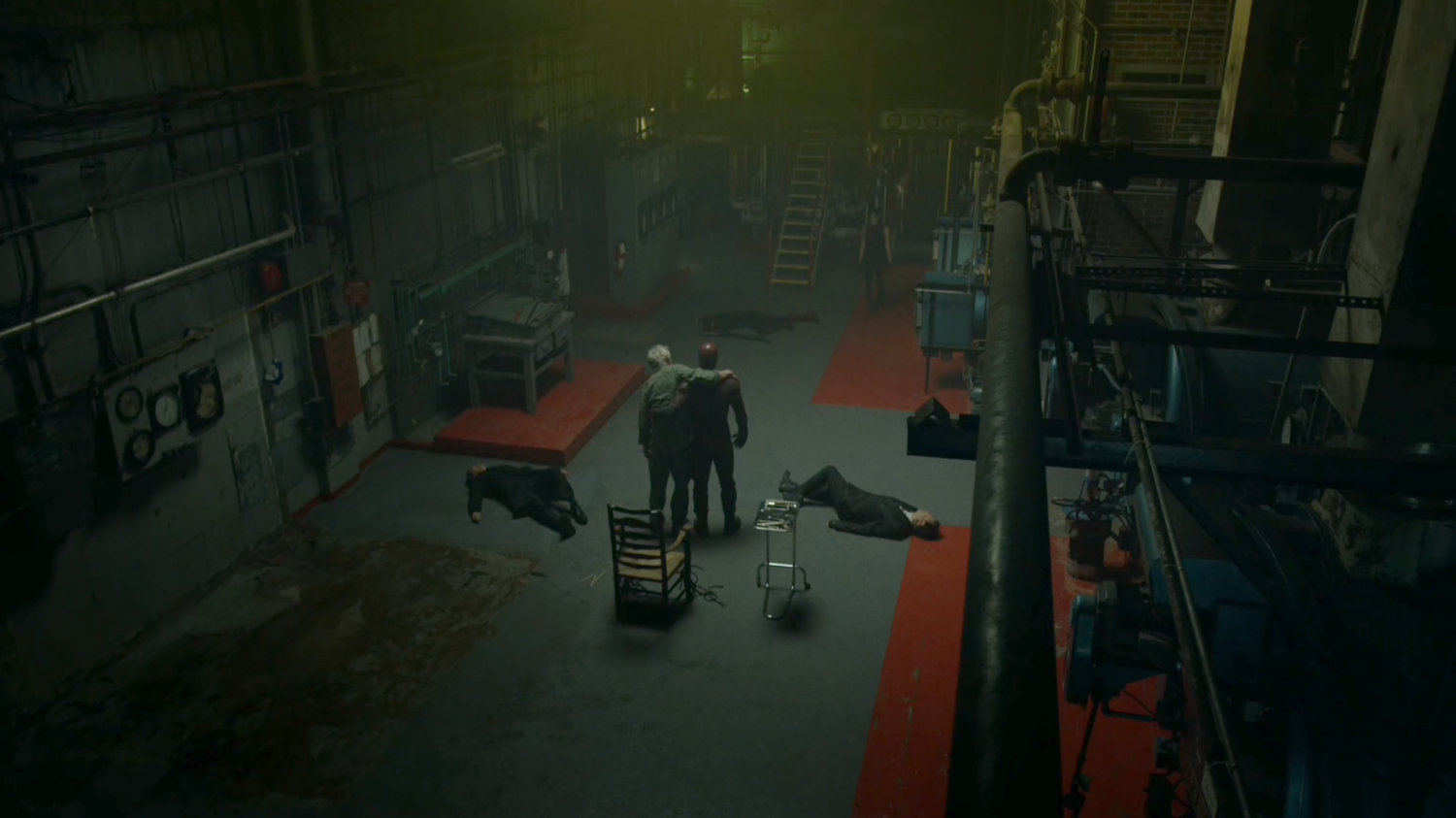 High angle shot of Daredevil helping Stick through an abandoned steam plant.