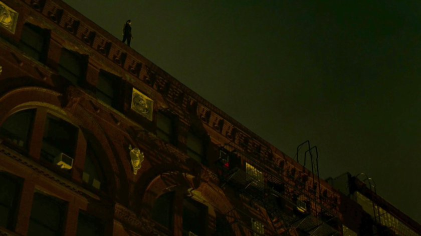 Elektra standing on the roof of Matt's apartment building.