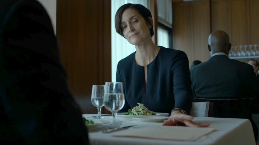 Jeri Hogarth sliding paperwork across table to Foggy in an upscale restaurant.