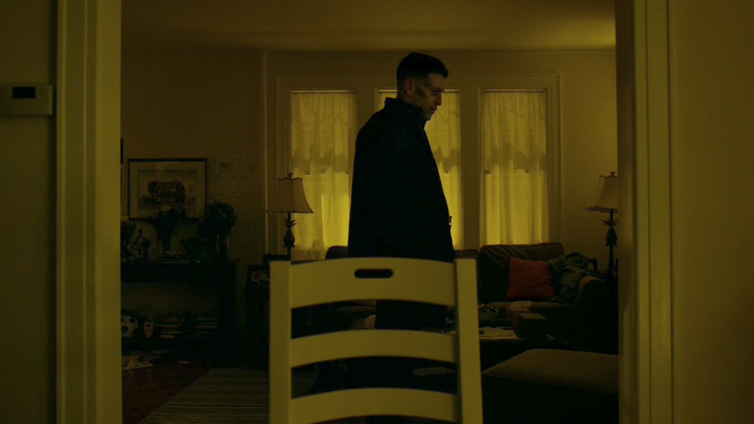 Frank Castle in the living room of his house.