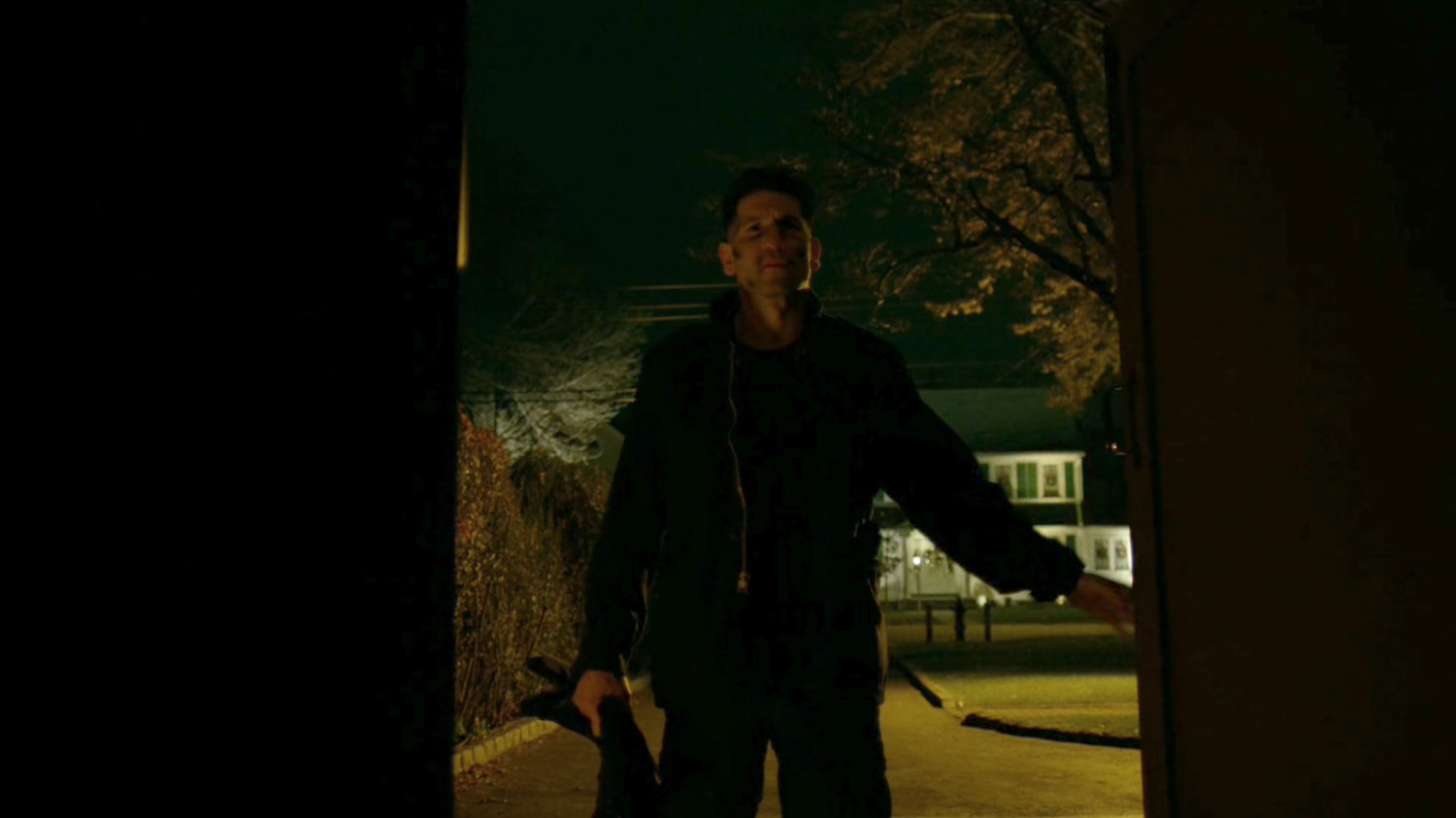 Frank Castle entering his shed.