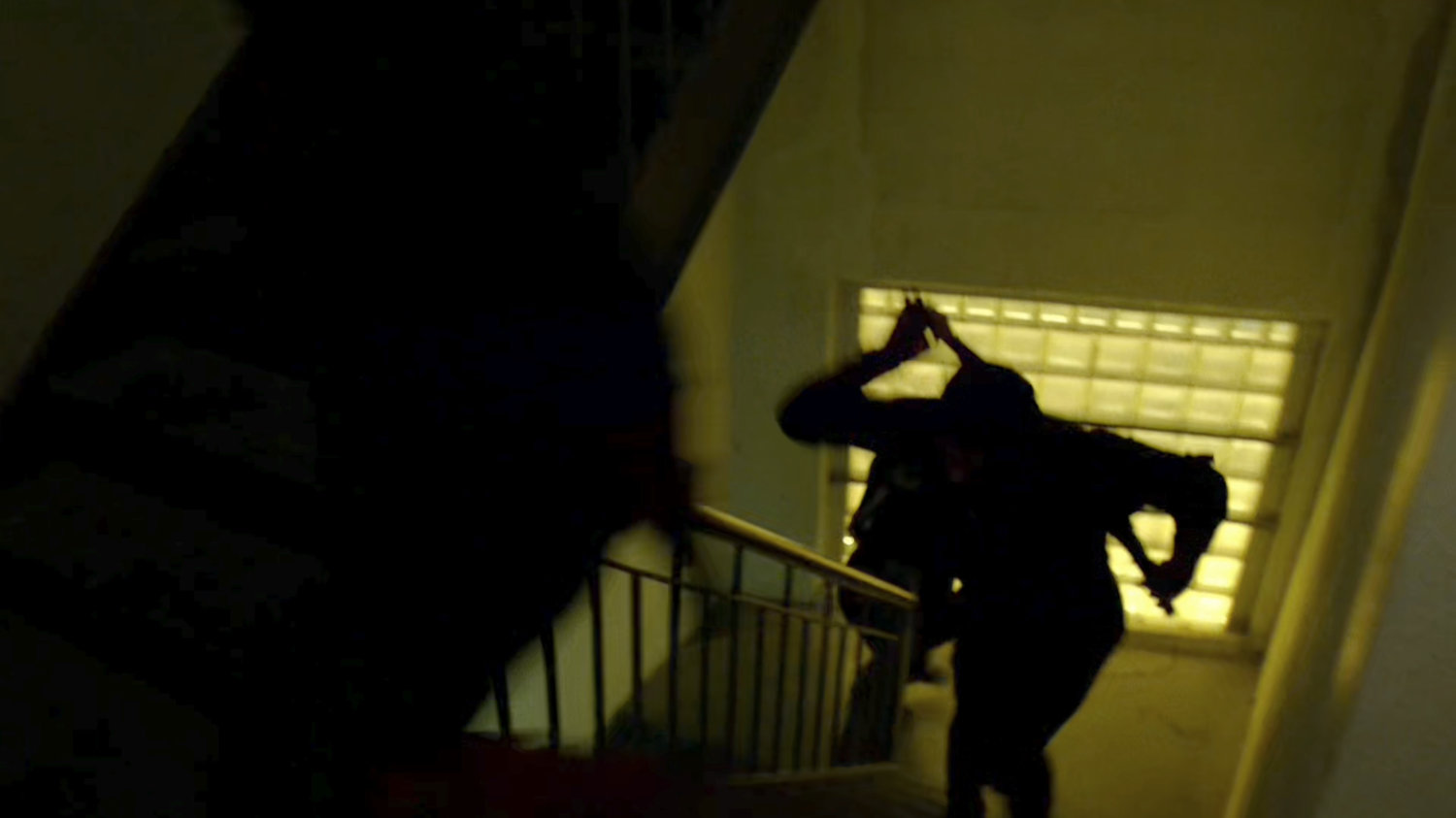 Ninjas run upstairs in abandoned warehouse.